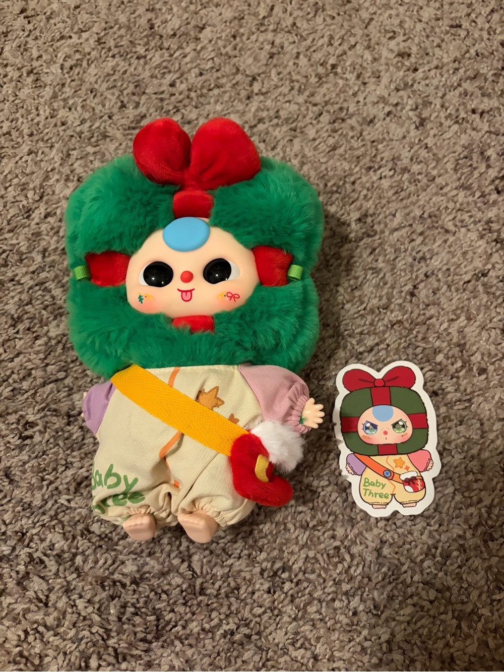 Baby Three Plush Doll - Green Fur with Red Bow